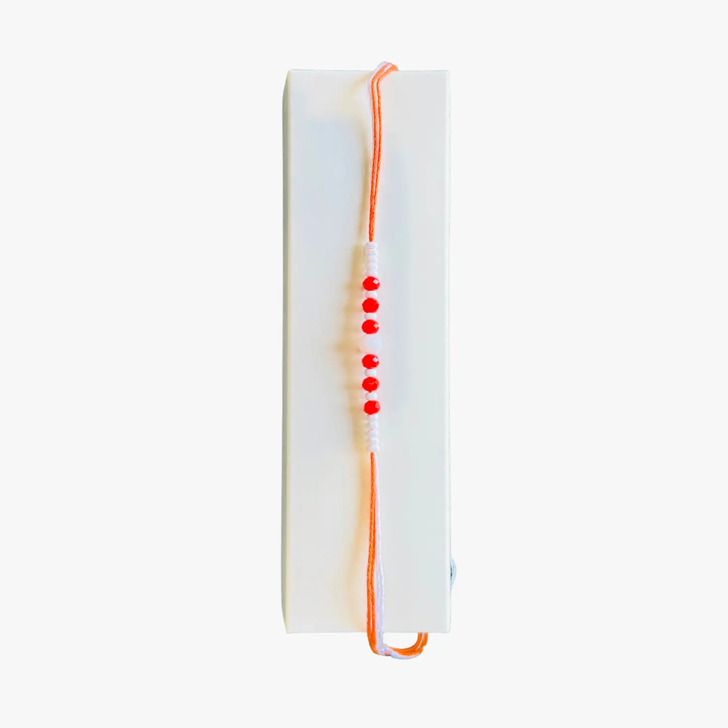 Orange and White Stone Rakhi 1
