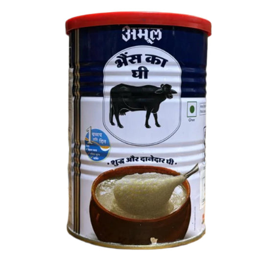 Aamul Buffalo Desi Ghee in a 1 litre tin with a predominantly white label that features a picture of a cow and text.