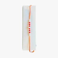Orange and White Stone Rakhi 1