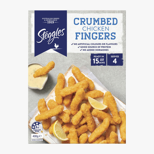 Package of Steggles crumbed chicken fingers with lemon wedges on a white background