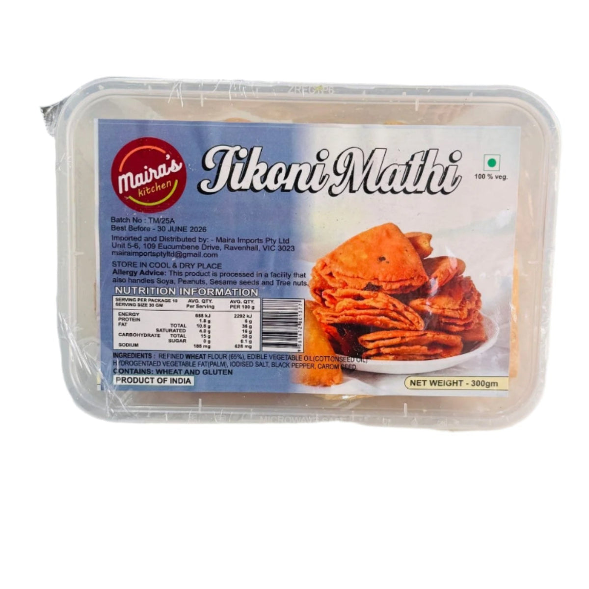 Packaging of Tikoni Mathi (Indian snack) showing the product name and an image of the triangular-shaped crackers.